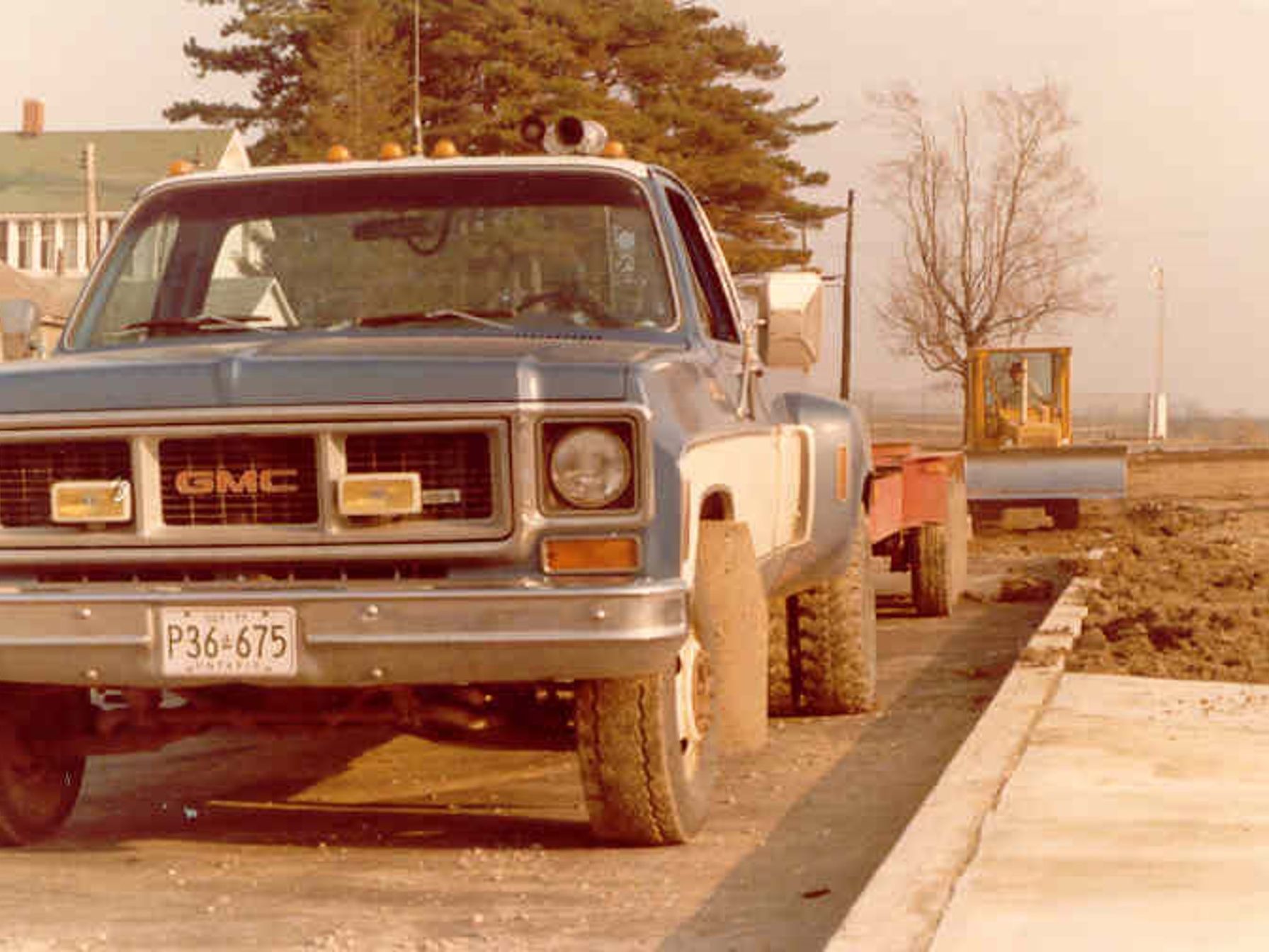 Vintage gmc truck is parked on the side of the road J-AAR History 