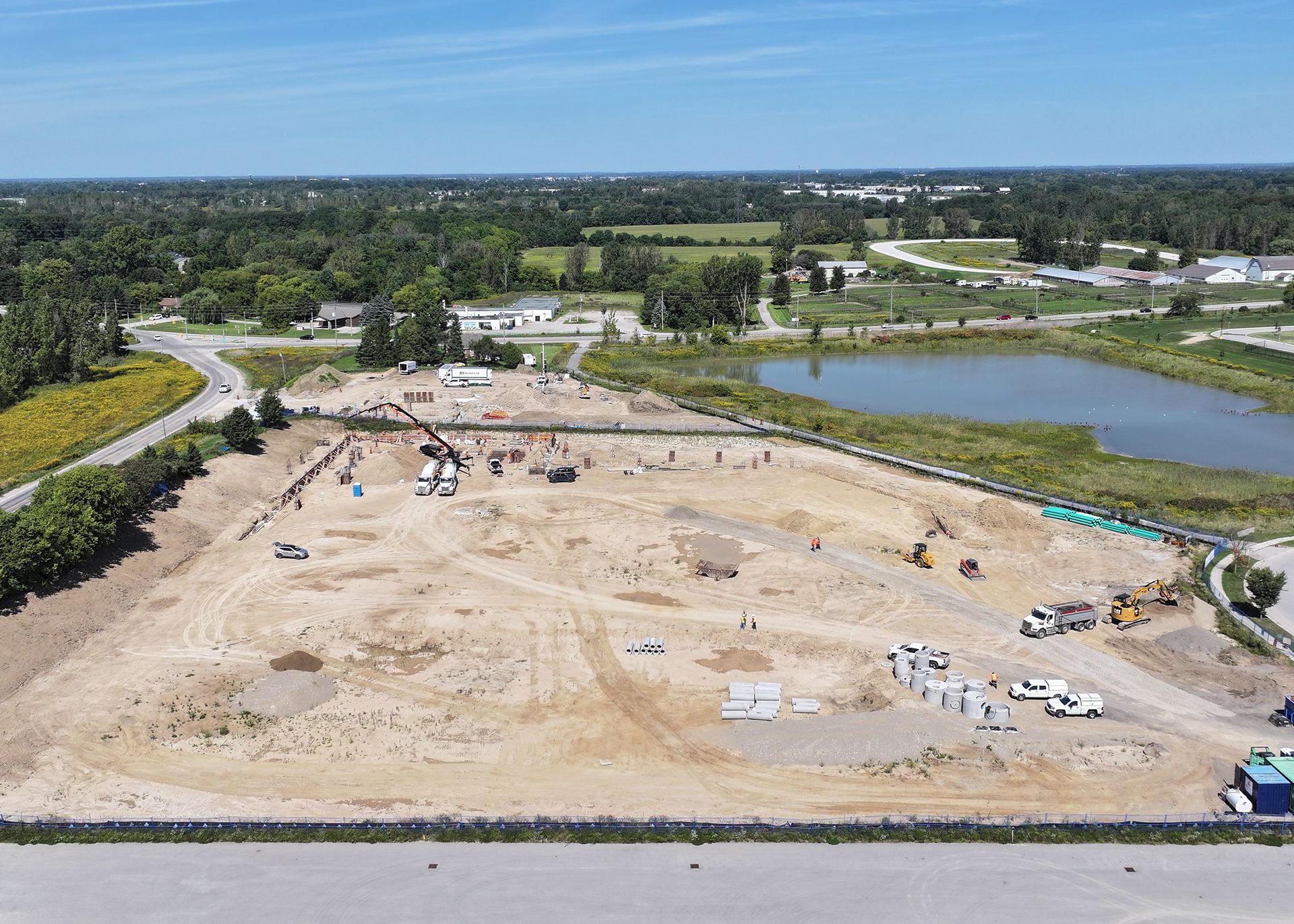 An aerial view of a construction site with a large building under construction.