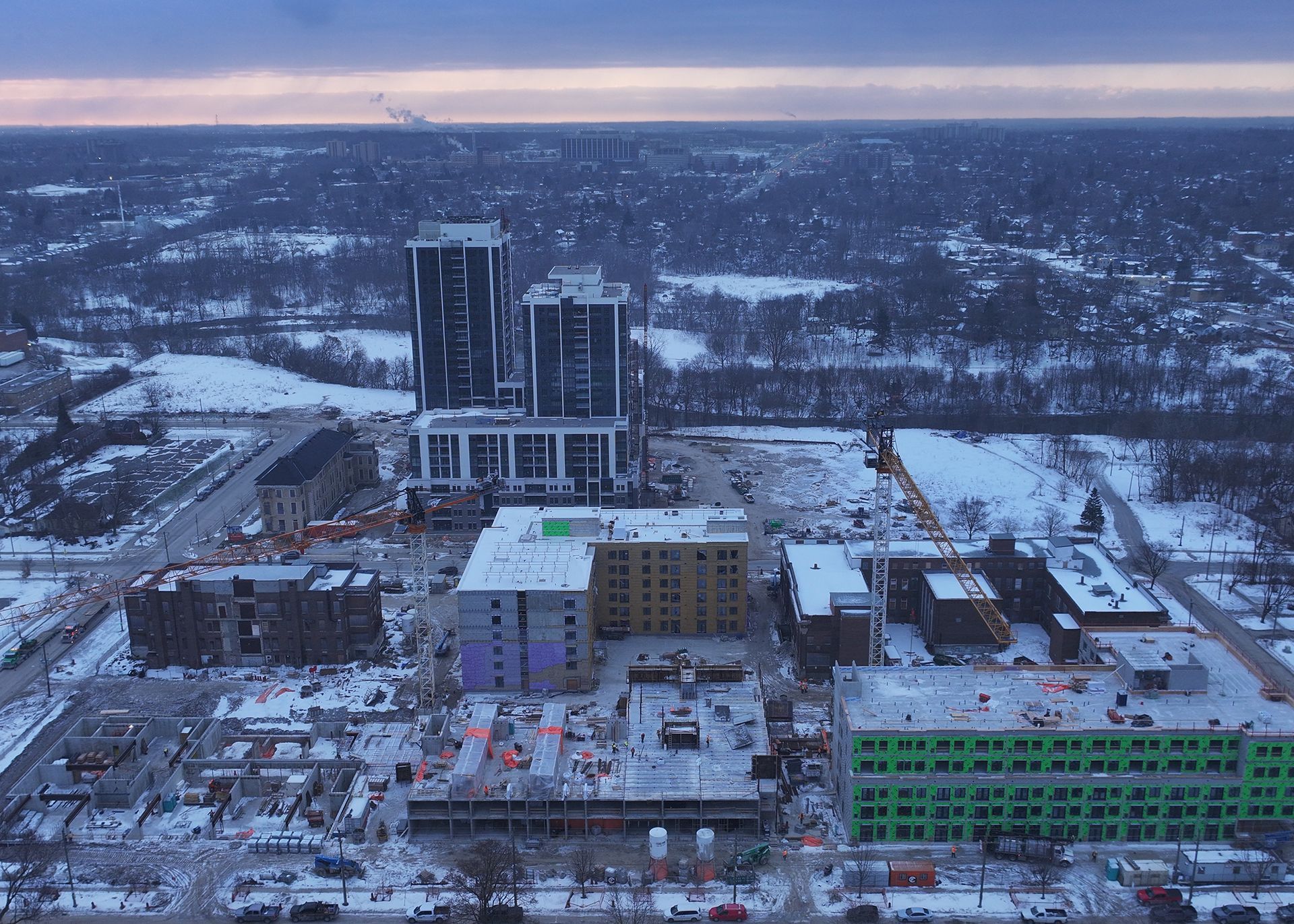 an aerial view of a building under construction in a residential area .