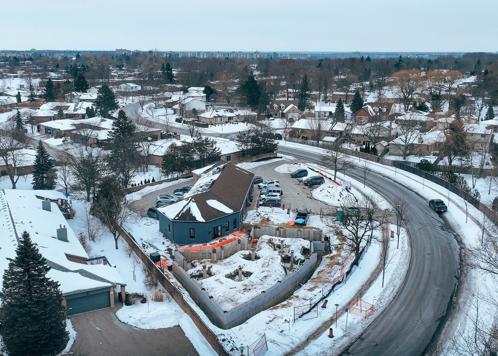 an aerial view of a building under construction in a residential area .