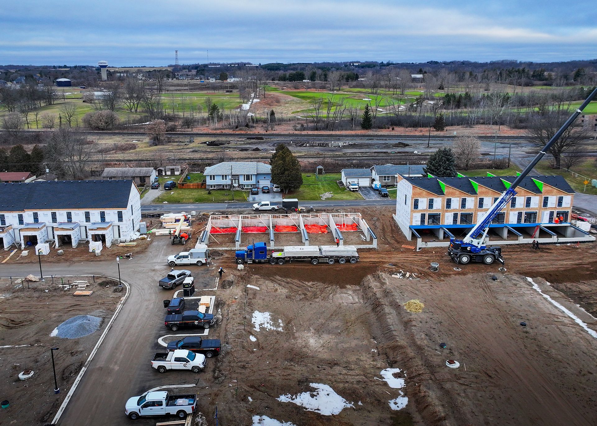 an aerial view of a building under construction in a residential area .