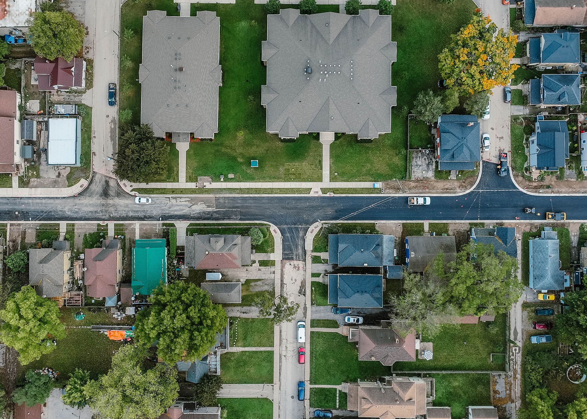 An aerial view of a city with a highway going through it.