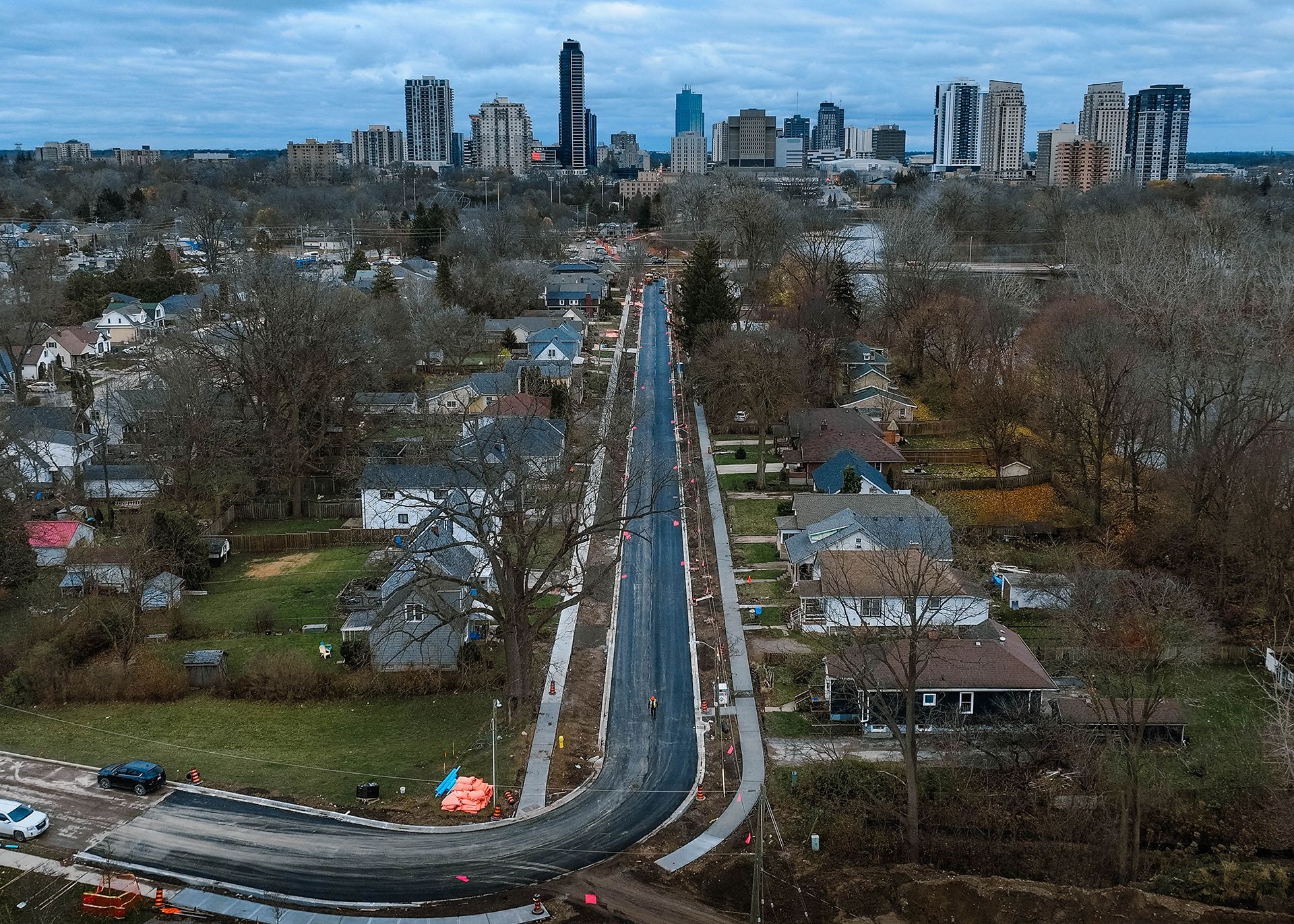 An aerial view of a city with a highway going through it.