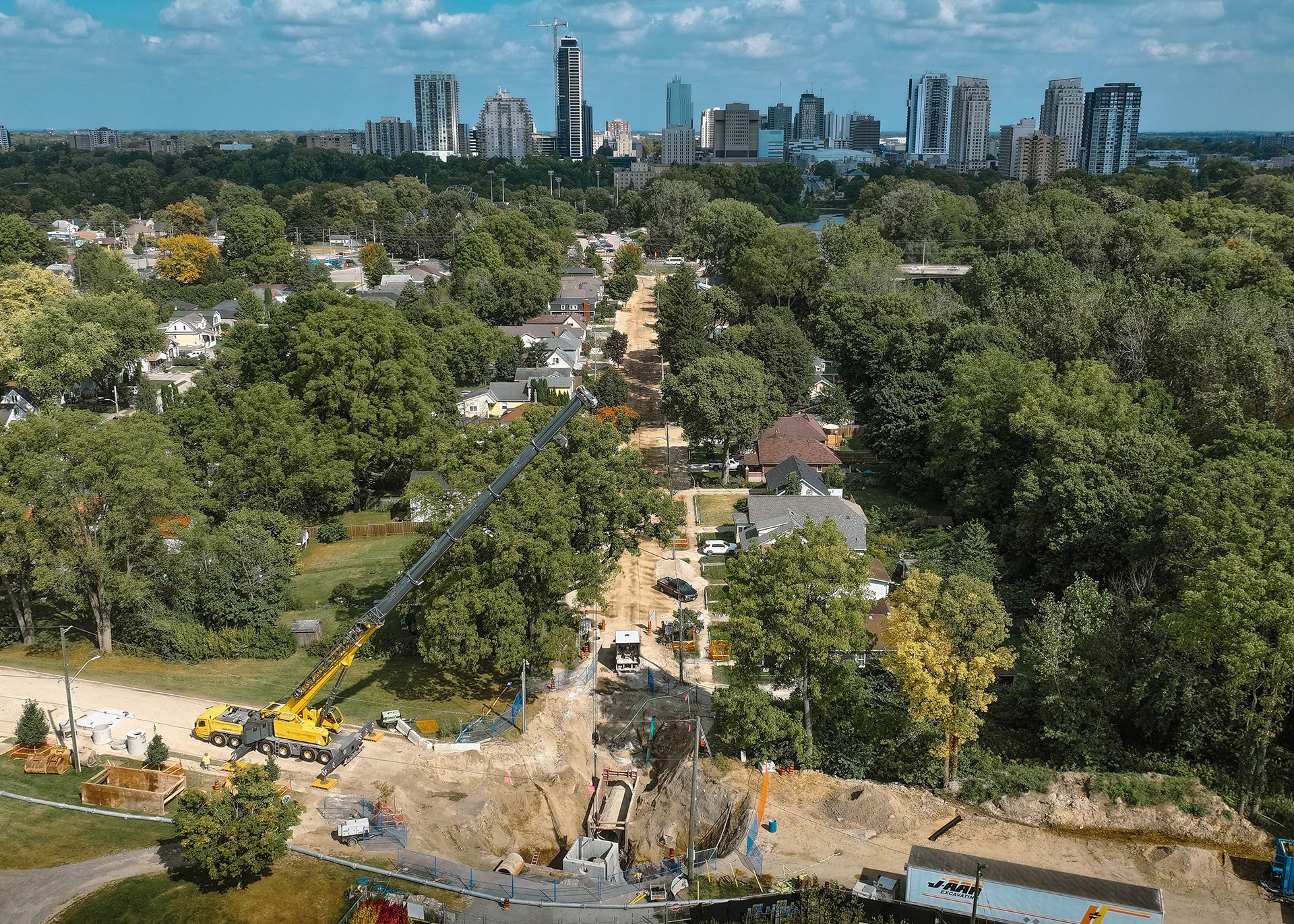 An aerial view of a city with a lot of trees and houses.