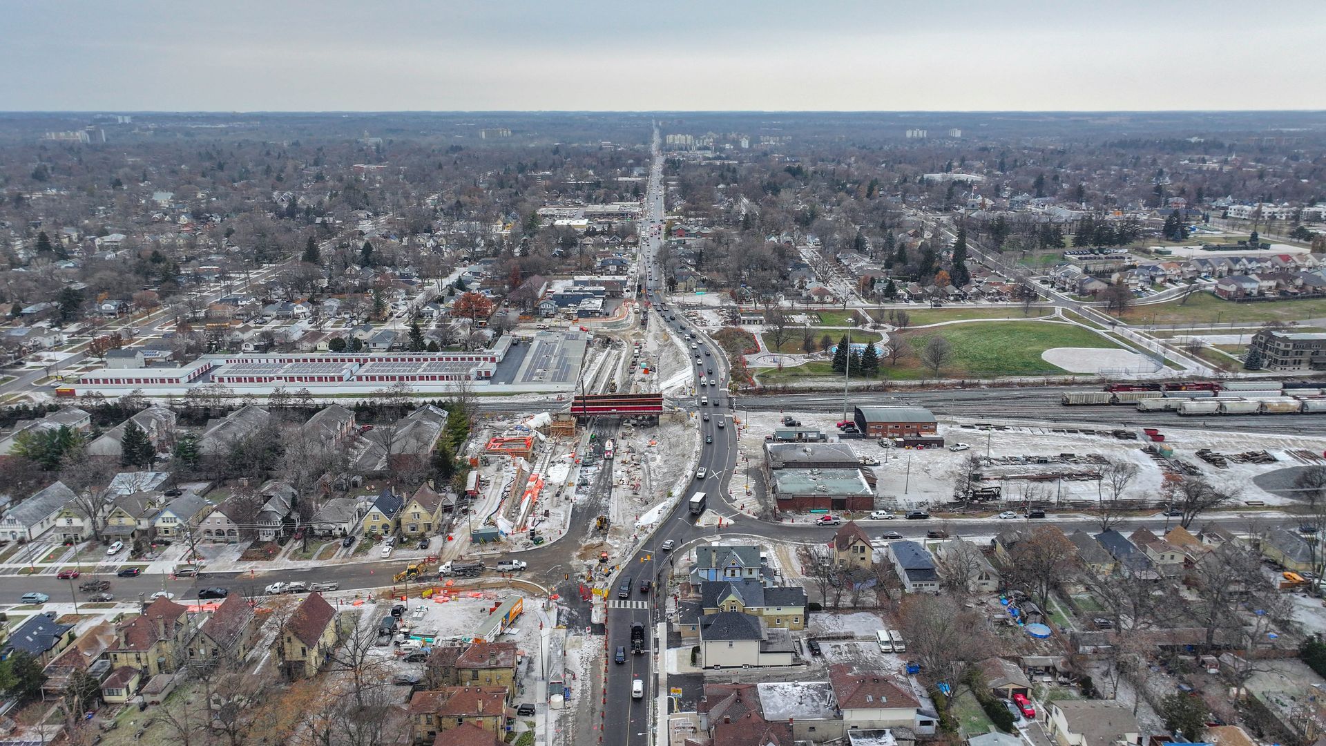 An aerial view of a city with a highway going through it.