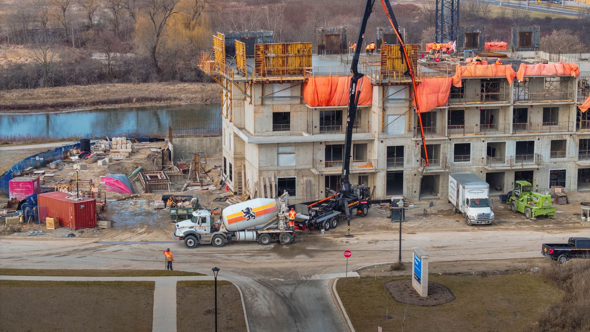 an aerial view of a construction site with a concrete mixer truck for J-AAR