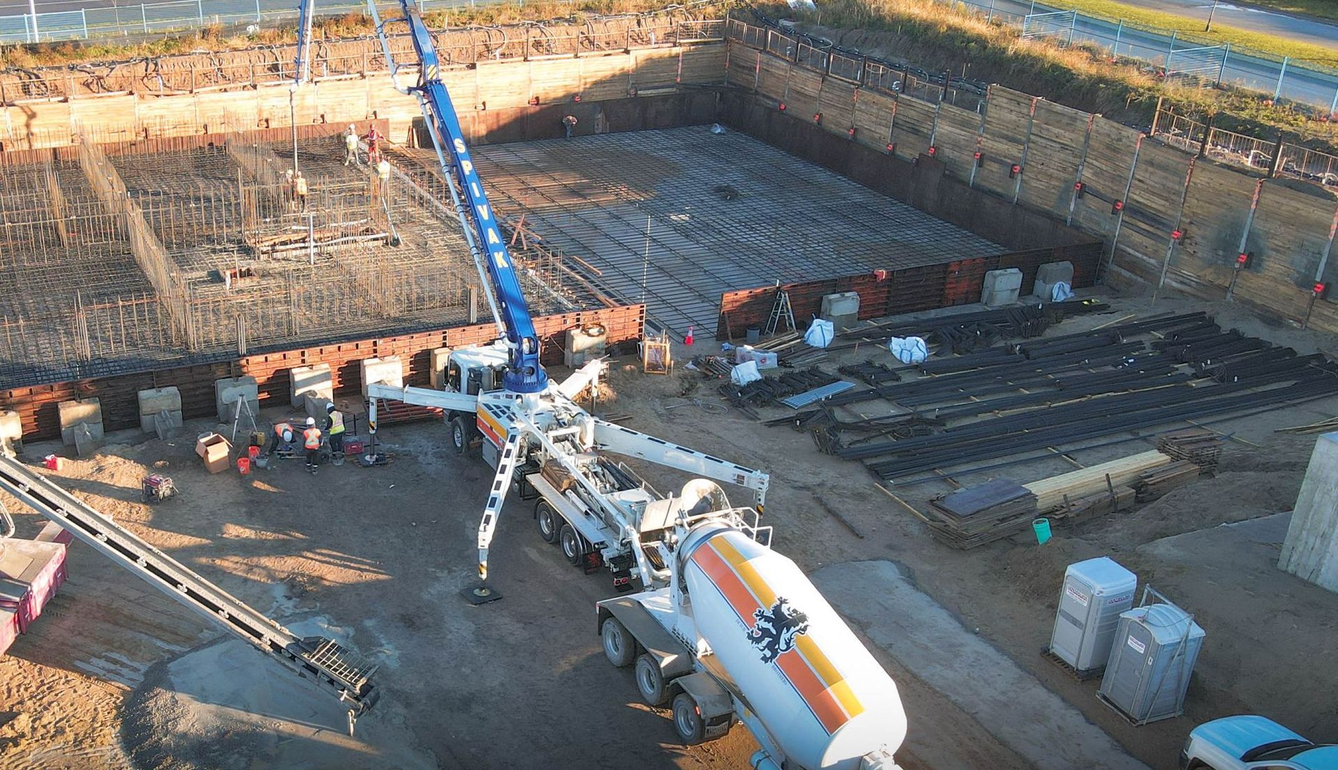 an aerial view of a concrete pump truck at a construction site .