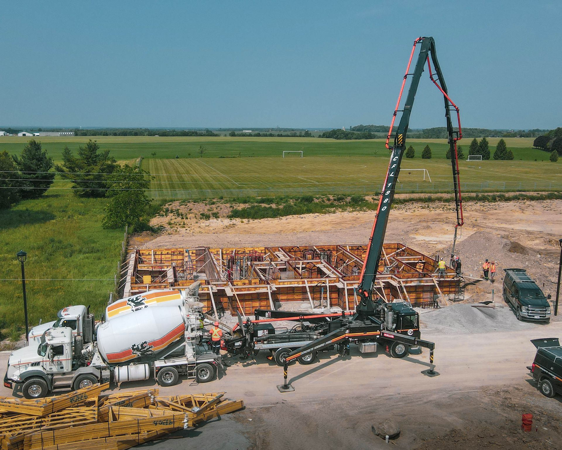 an aerial view of a construction site with a concrete pump .