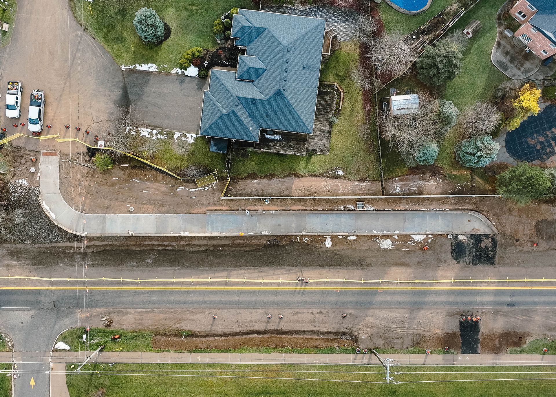 An aerial view of a busy intersection with a roundabout in the middle.