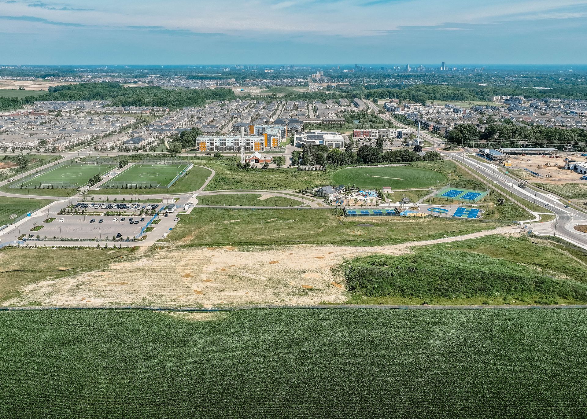 An aerial view of a highway intersection with a store in the middle of it.