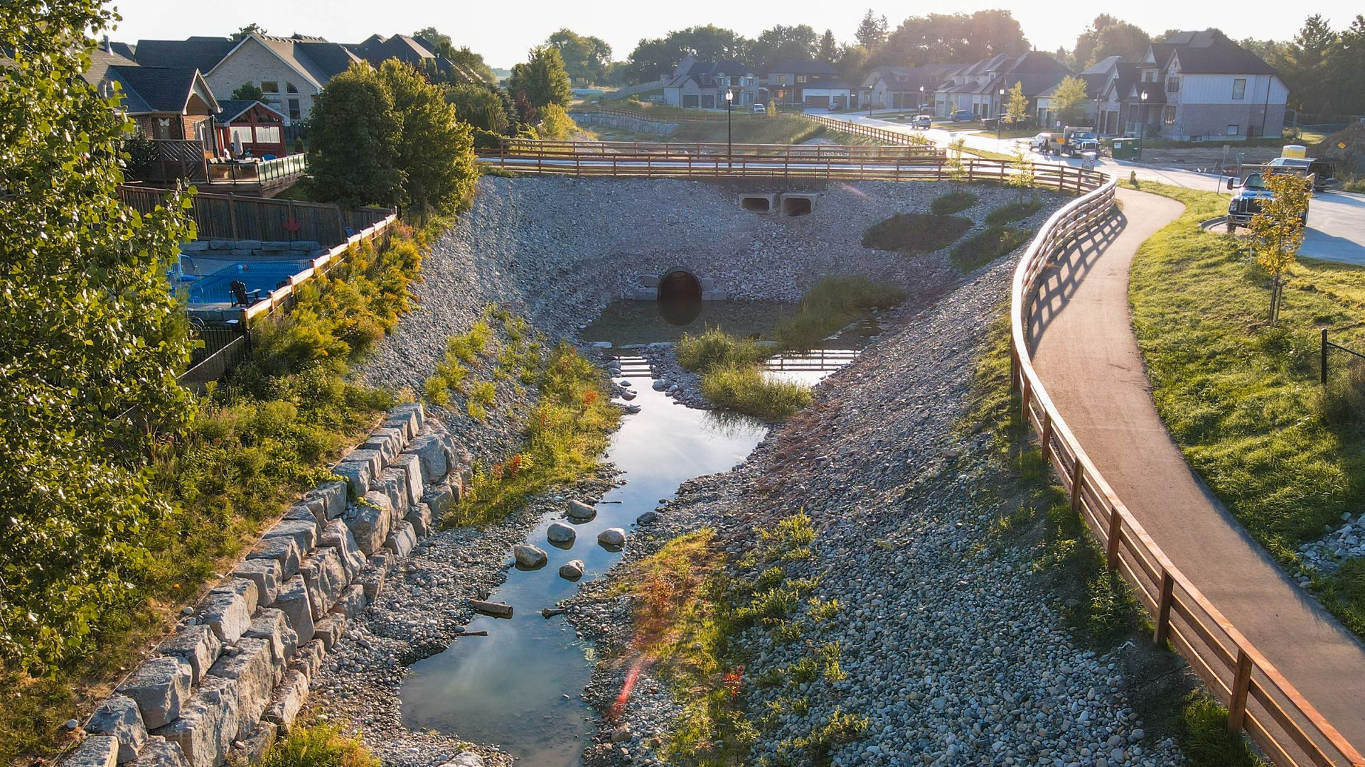 A river with a bridge and a path going through it