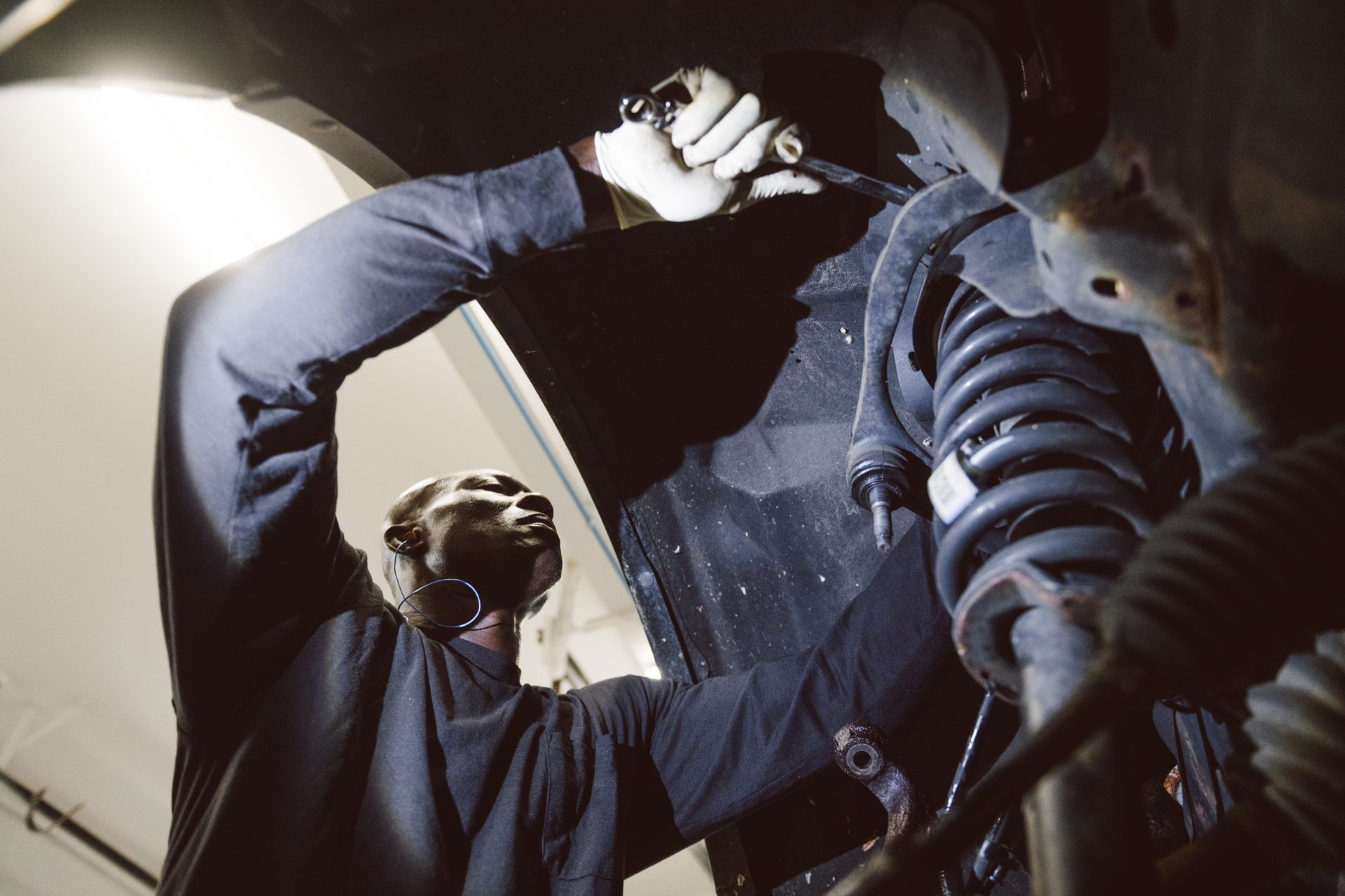 technician fixing vehicle