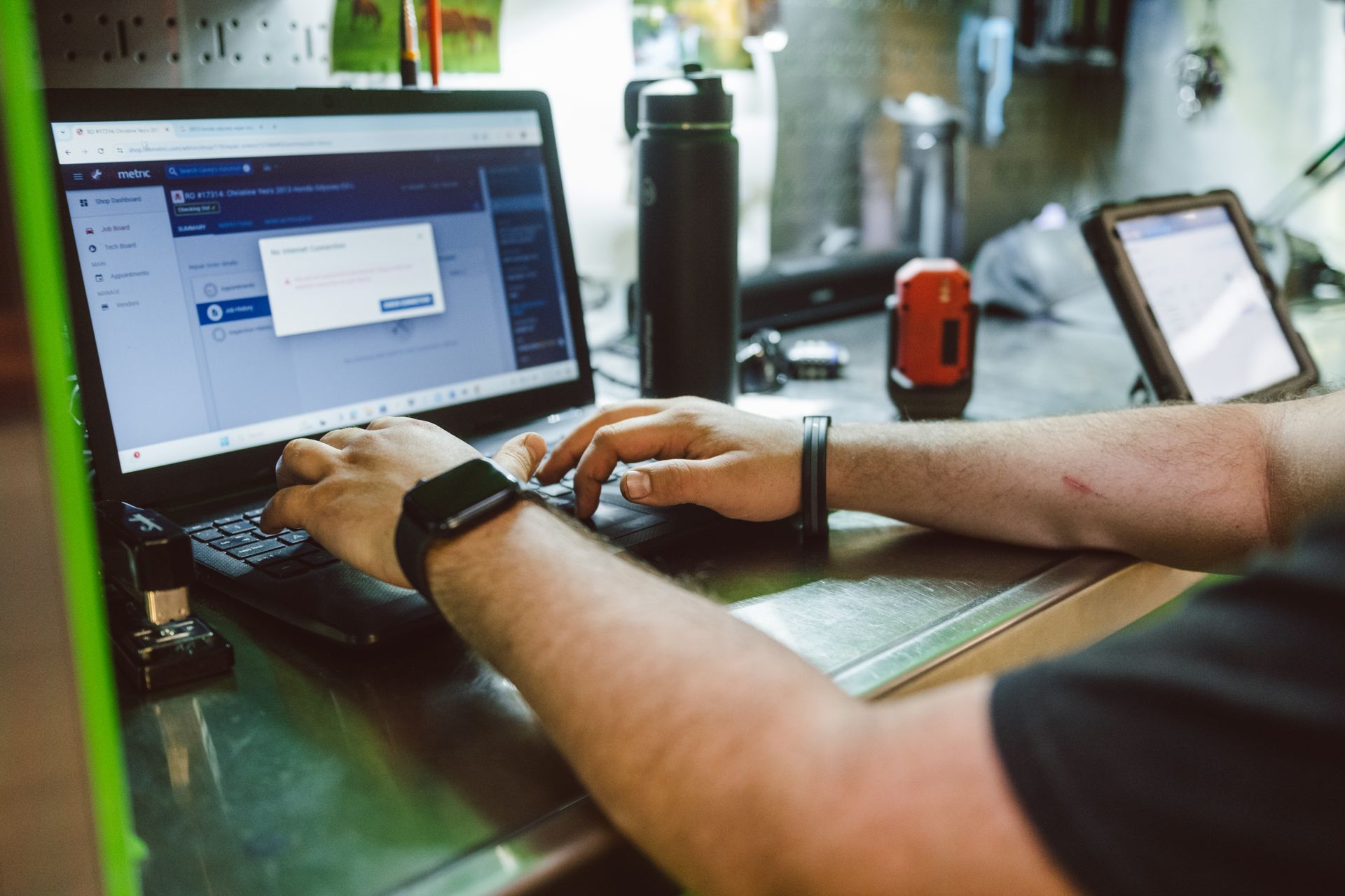 man adding info to computer