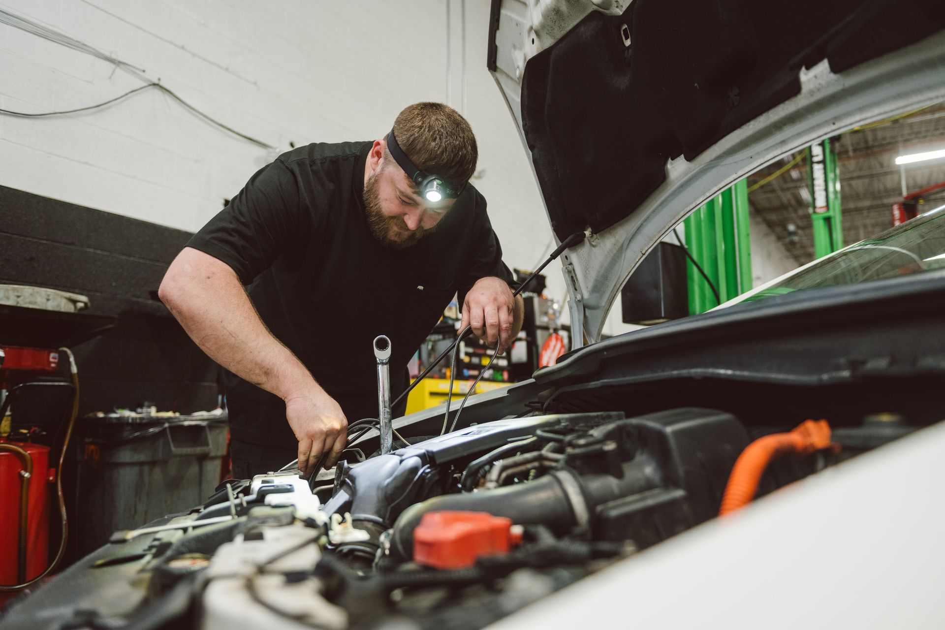 technician checking under the hood
