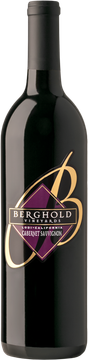 A bottle of black and gold wine with a purple label