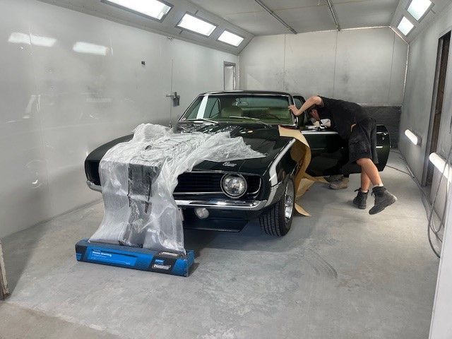 A Car Is Parked In Front Of An Auto Body Shop — ABS Repairs in Manunda, QLD