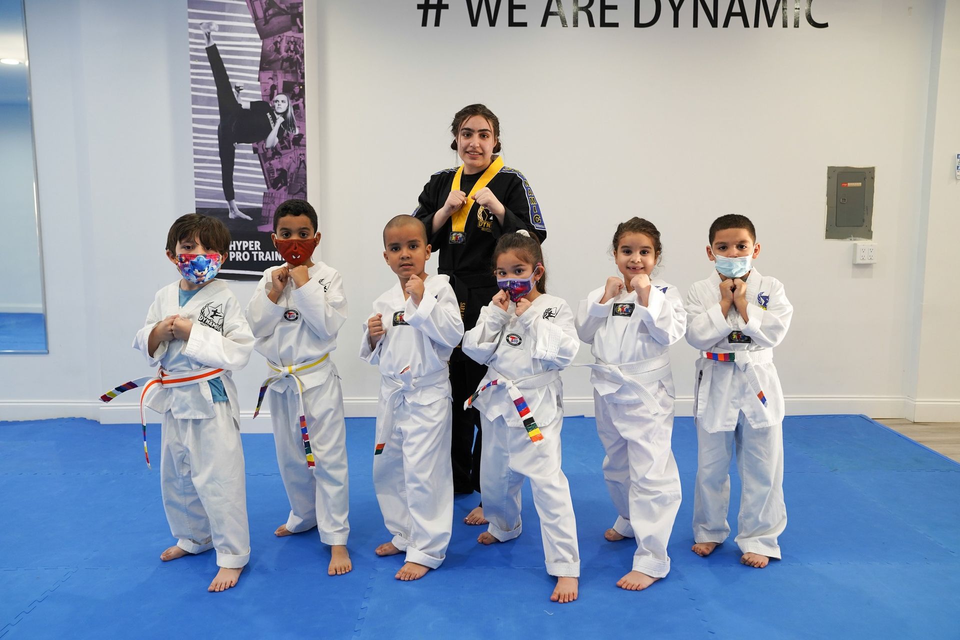 A person is holding a sparkler in their hand in the dark.