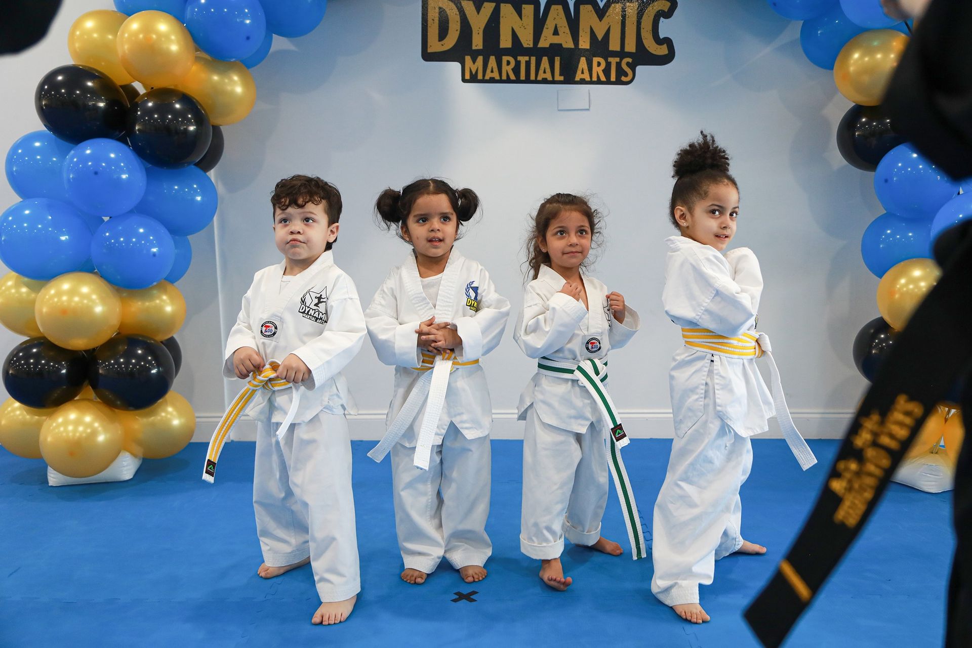 A person is holding a sparkler in their hand in the dark.