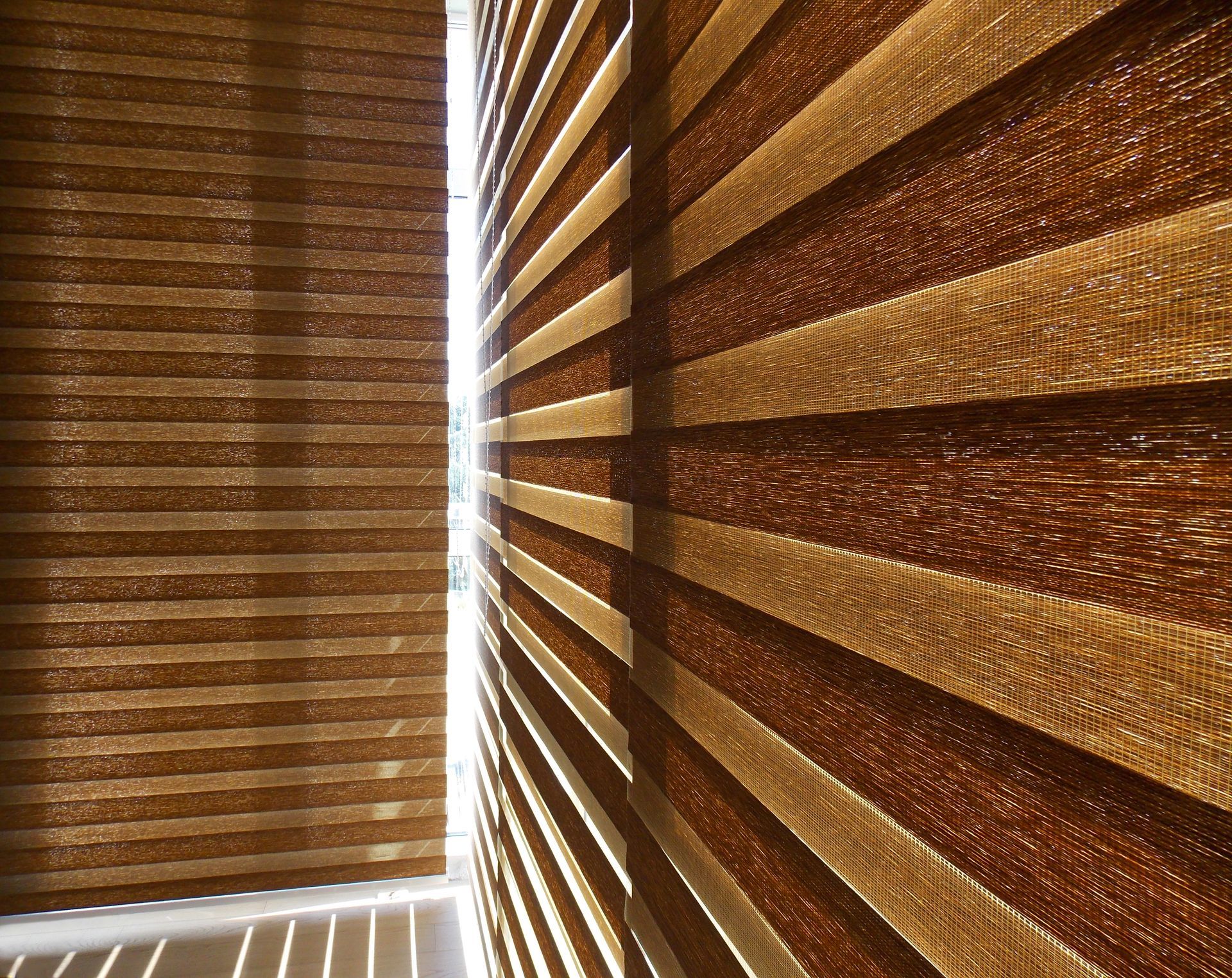 Custom roller shades on a corner window near San Antonio, TX