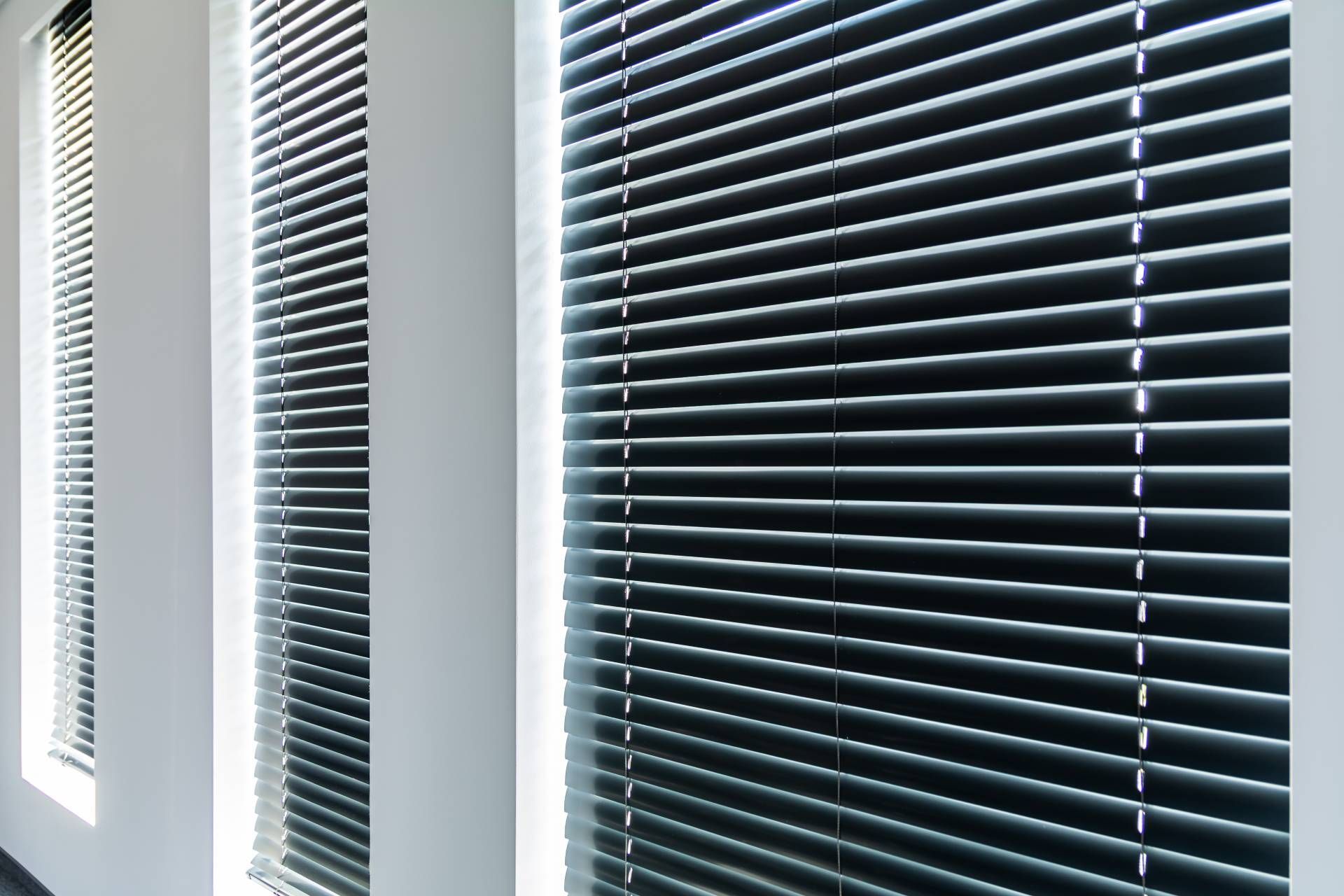 Three sets of modern horizontal blinds in a home near Boerne, Texas (TX)