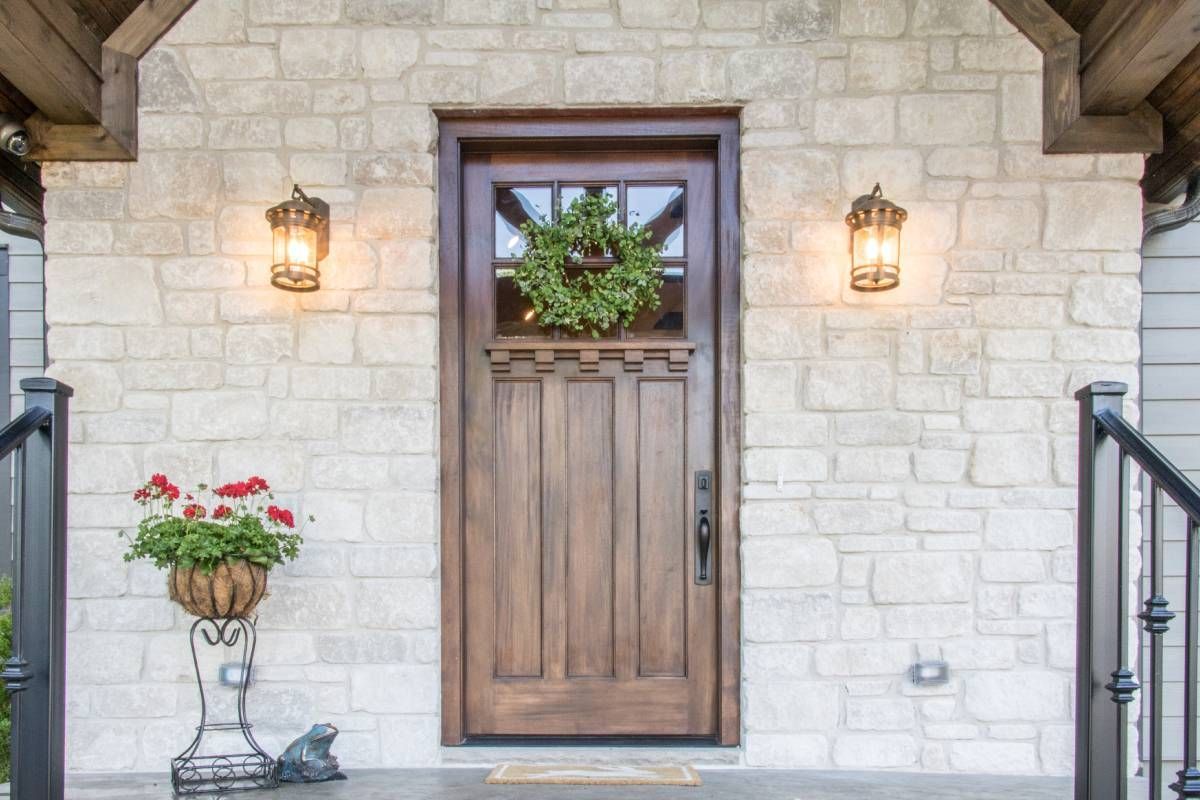 Front door of a house, including a window where you can use shades at Blinded By Delight near San Antonio, TX