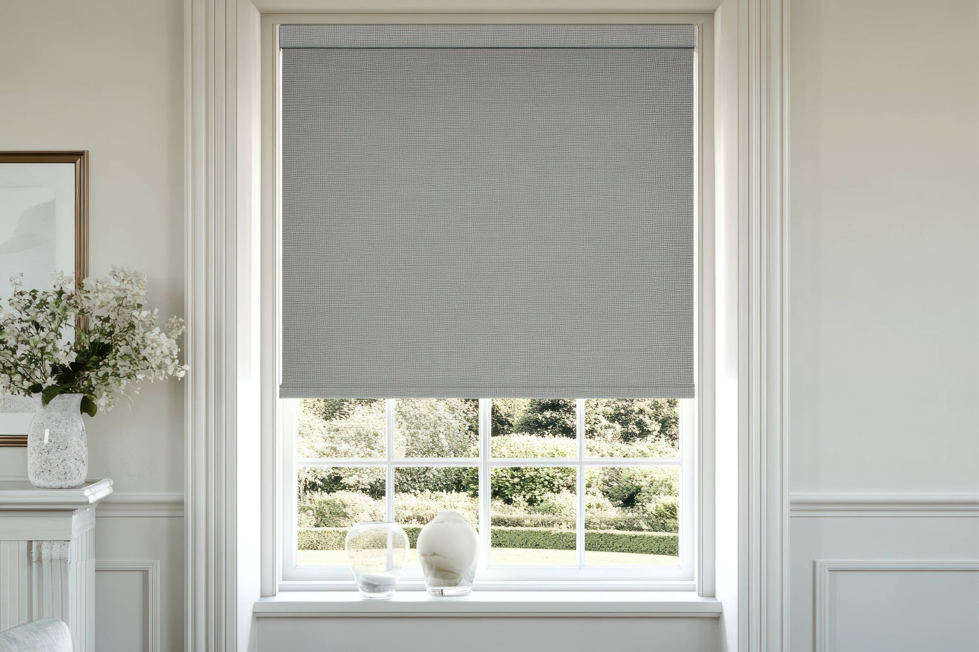 Gray roller shade in a modern living room at Blinded by Delight Window Coverings & Design near Boern