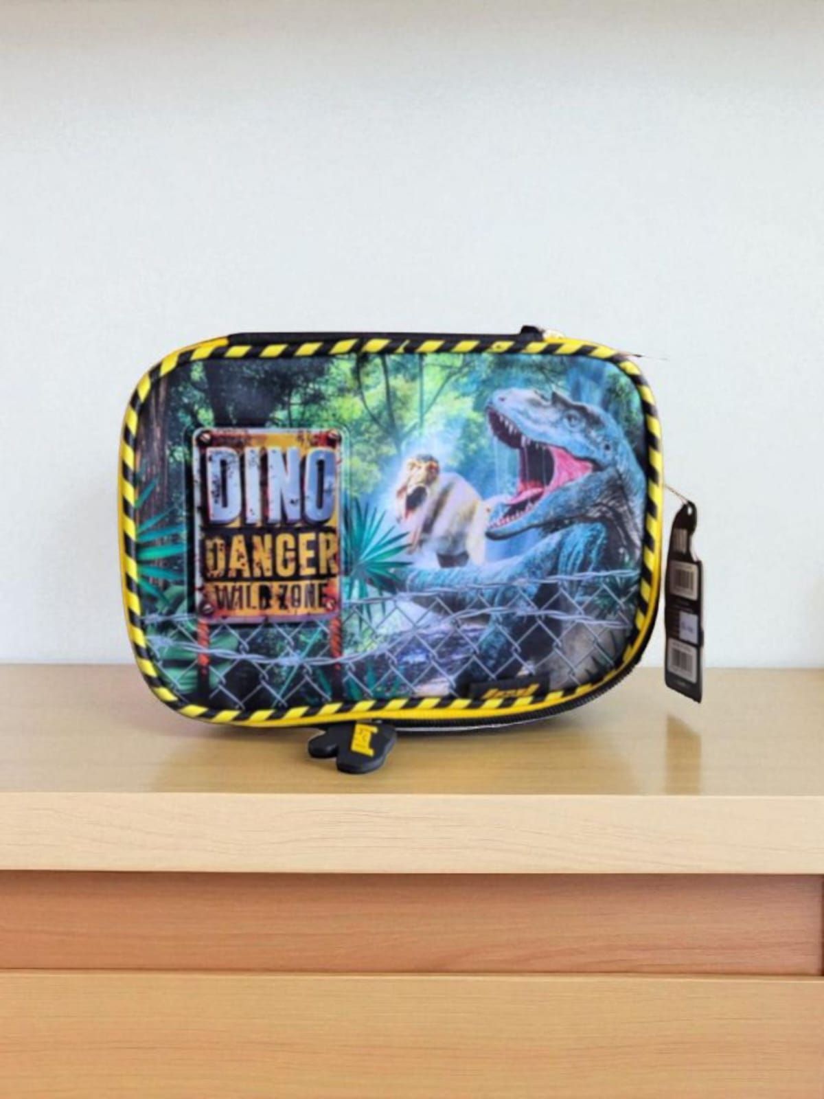 Estuche para lápices con un dinosaurio y la leyenda