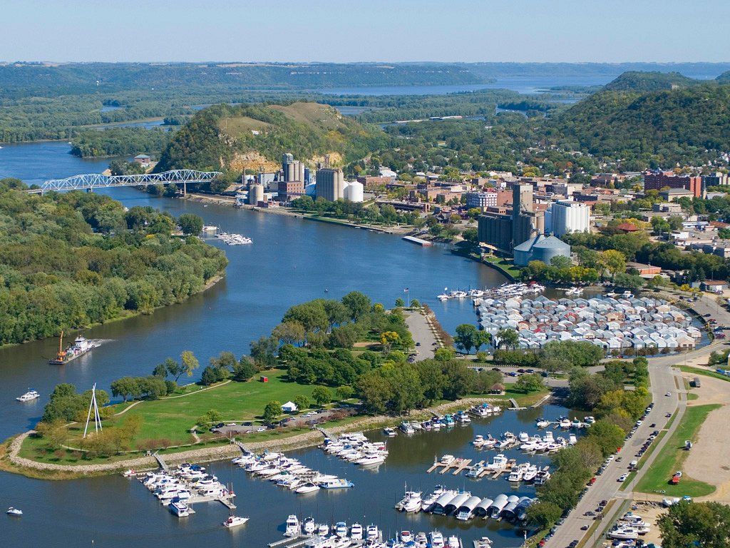 An aerial view of a large body of water with boats in it