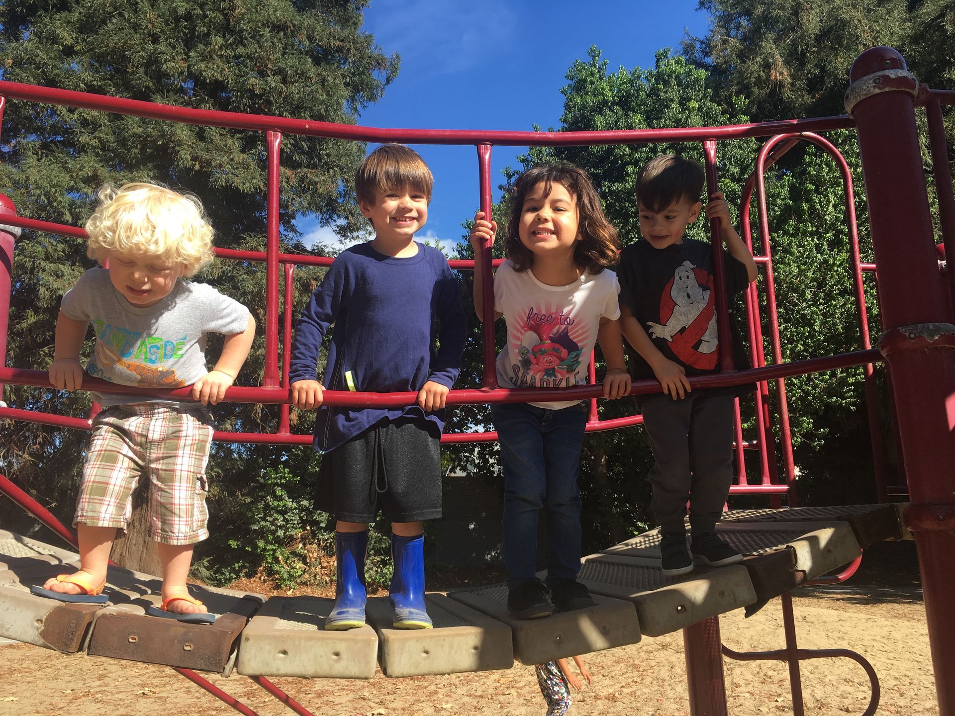 A group of children are playing on a playground.