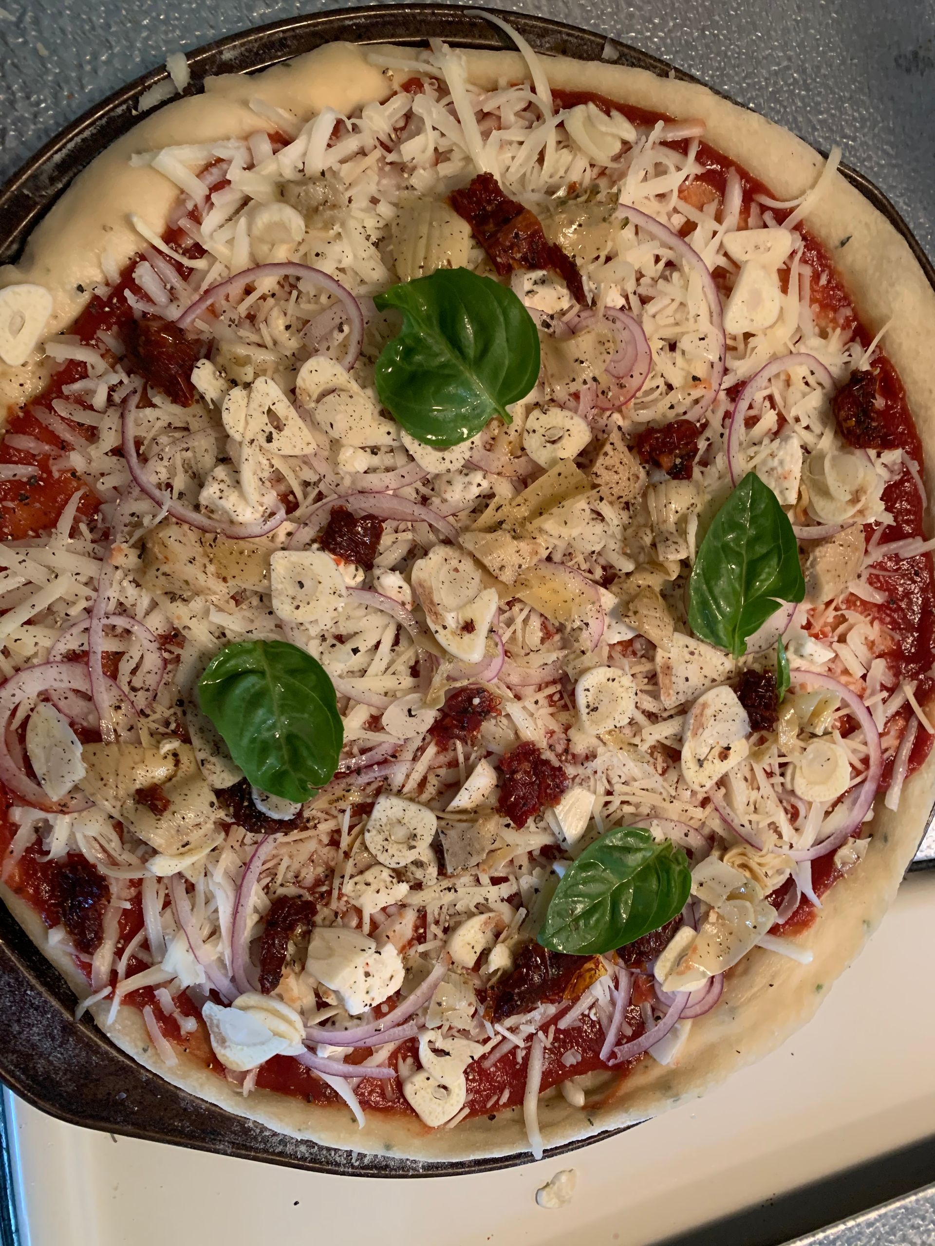 A pizza with a lot of toppings on it