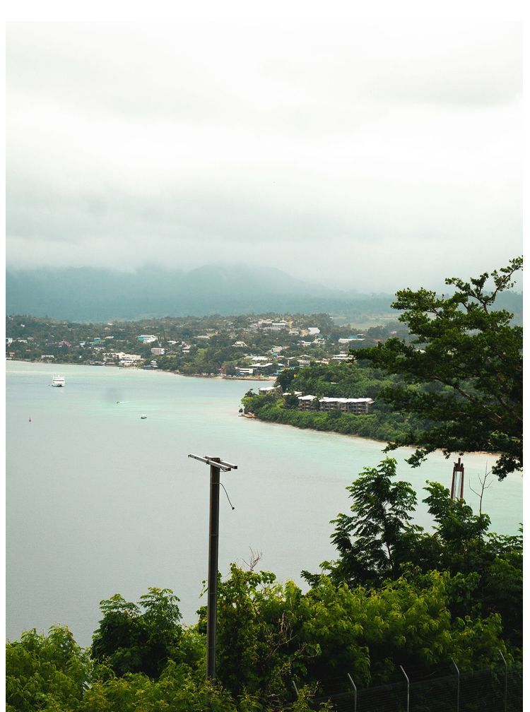 A view of a body of water with mountains in the background