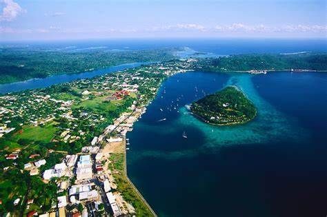 An aerial view of a small island in the middle of a large body of water.