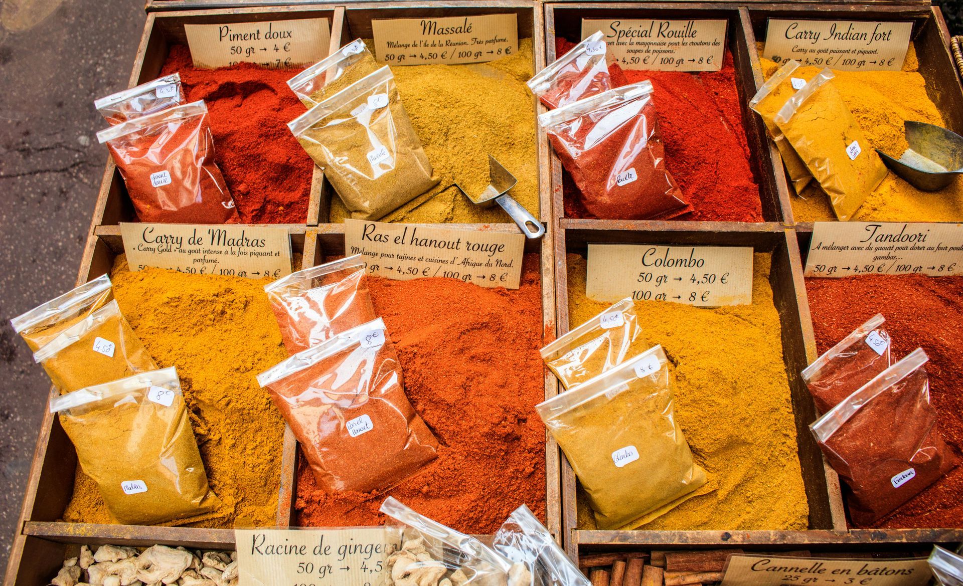There are many different types of spices in the boxes.