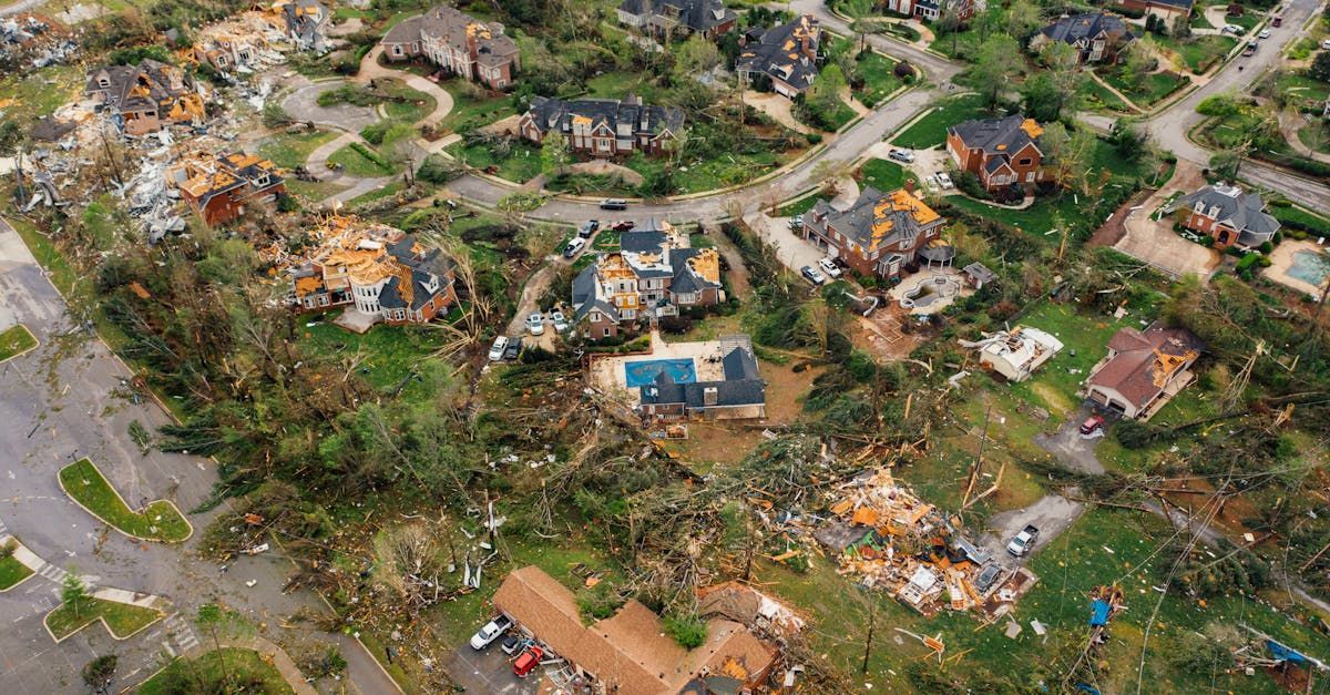 An aerial view of a residential area damaged