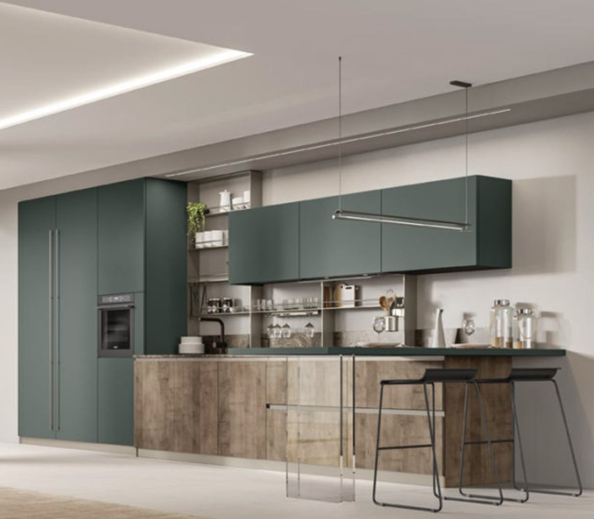 Una cucina con mobili verdi e ripiani in legno