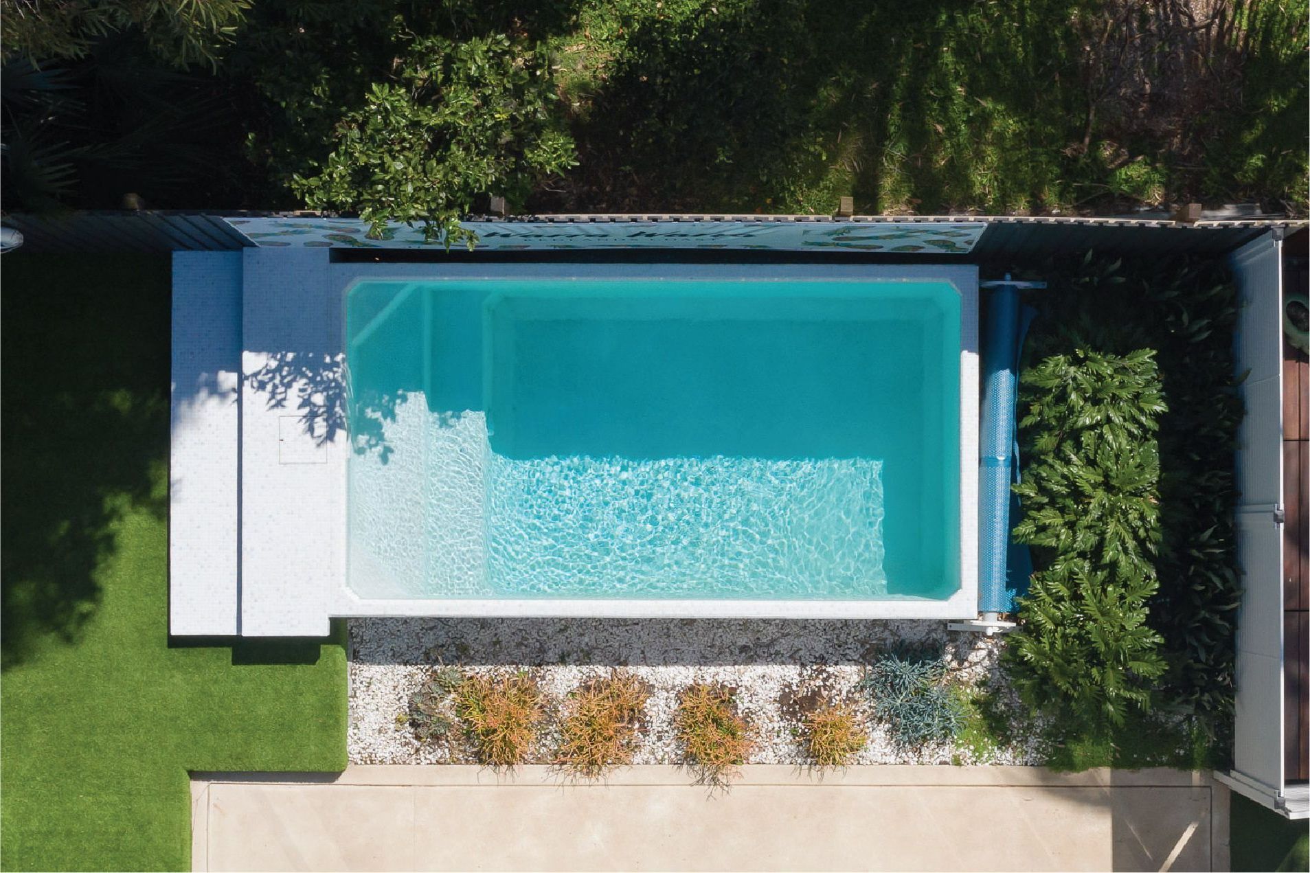 An aerial view of a Plungie Original swimming pool in a backyard