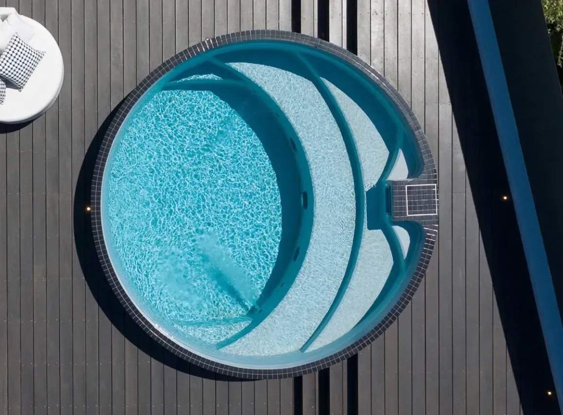 An aerial view of a circular Plungie arena swimming pool