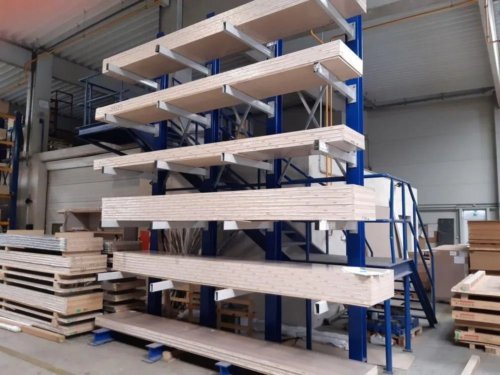 A Warehouse Filled with lots of Wooden Shelves and Stairs.