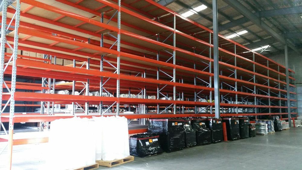 Warehouse Filled with Shelves and Pallets