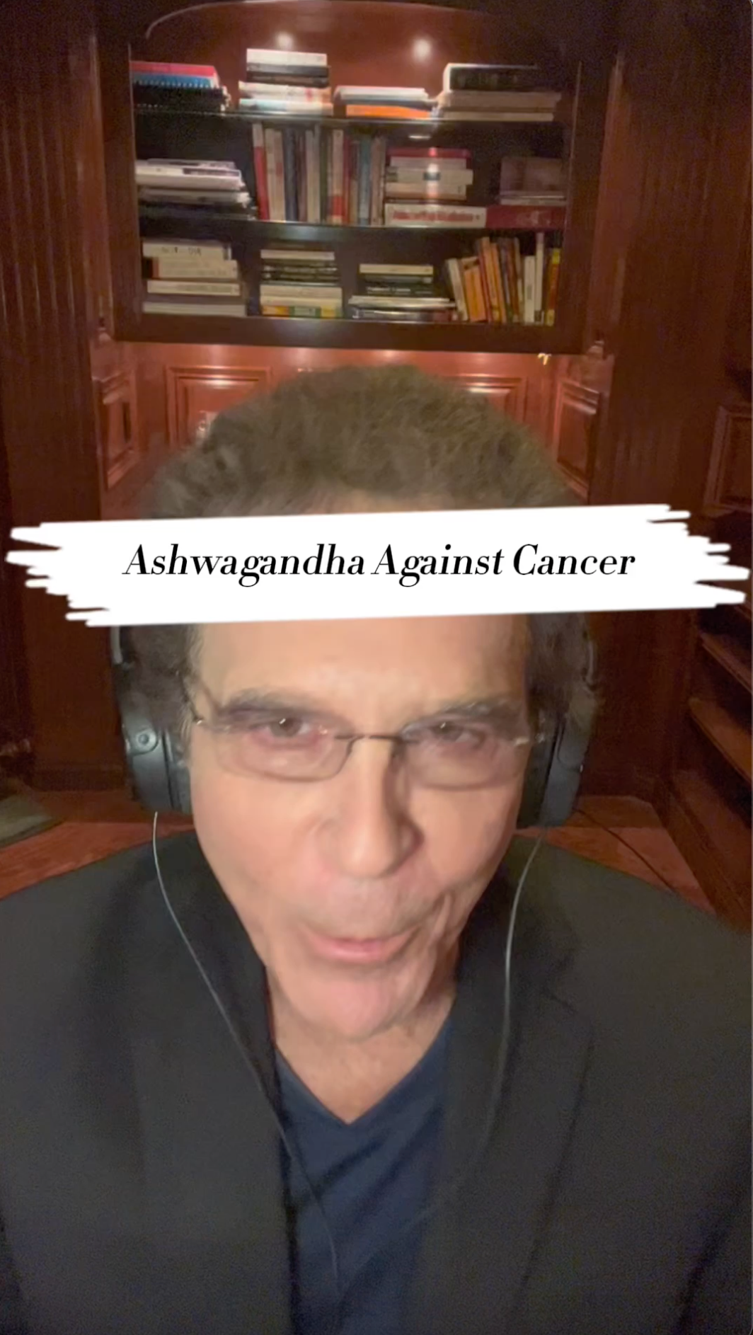 A man wearing headphones and glasses is talking about ashwagandha against cancer.