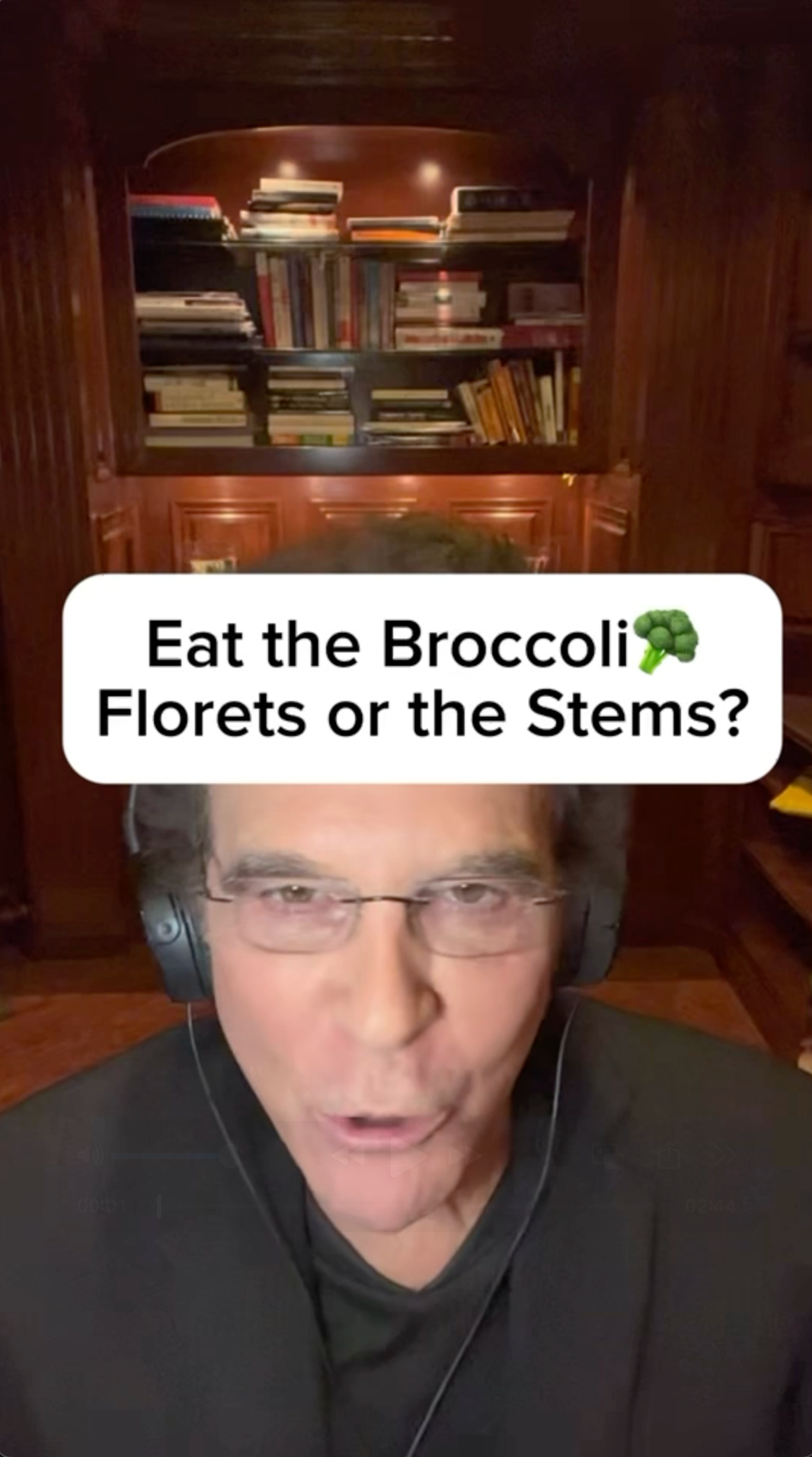A man wearing headphones is talking about broccoli florets or stems.