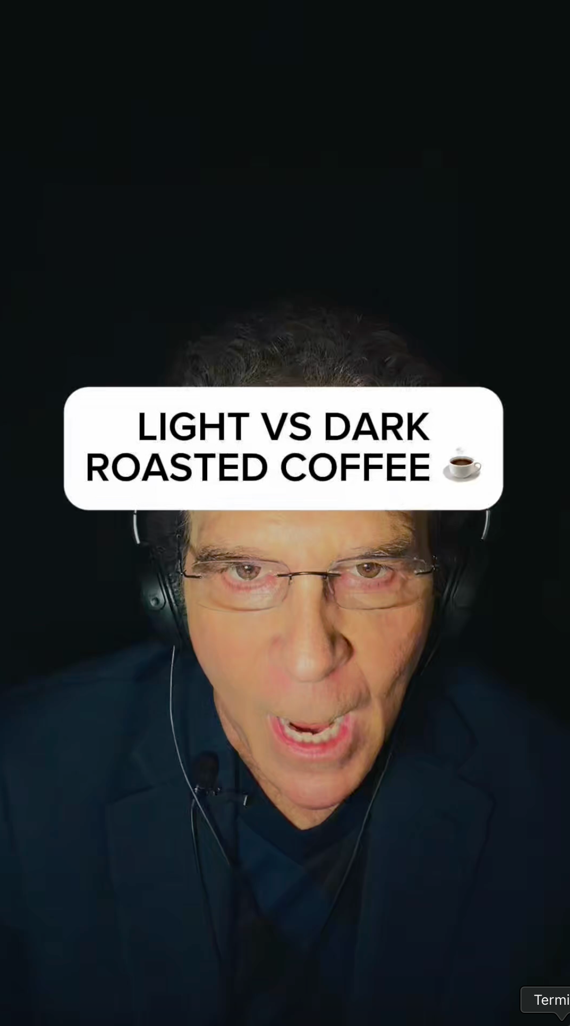 A person speaking with headphones against a black background, with a text overlay reading: