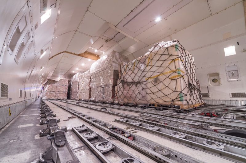 The inside of an airplane filled with cargo.