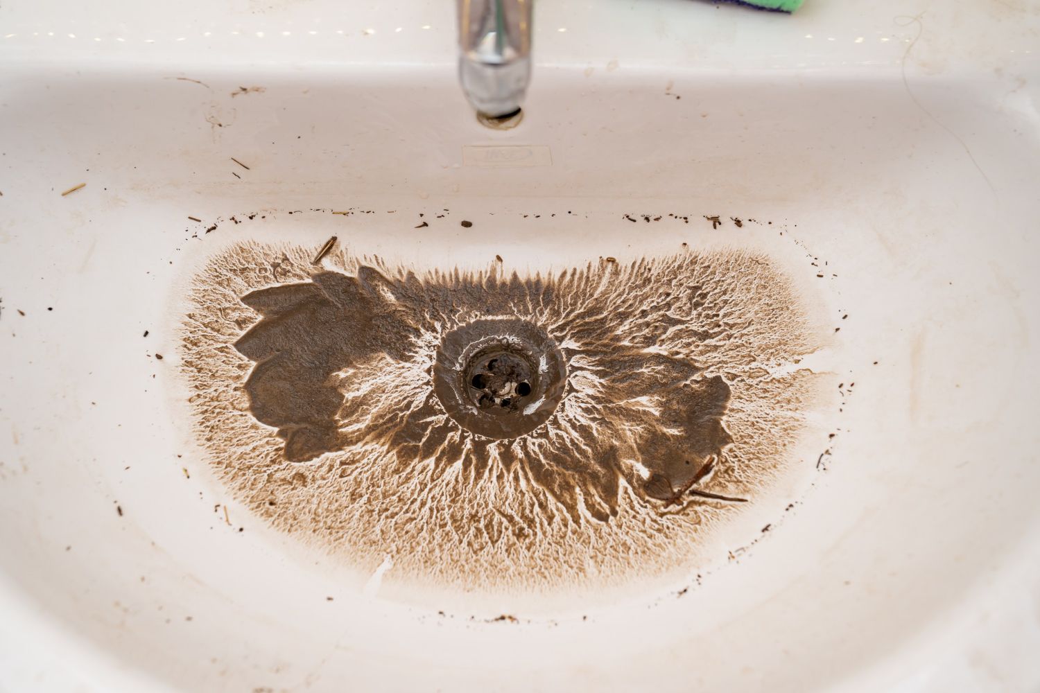 A backed up sink with sewage