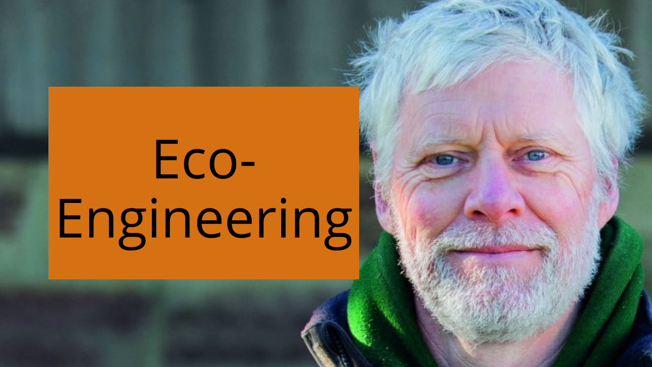 A man with a beard is standing in front of a sign that says eco engineering.