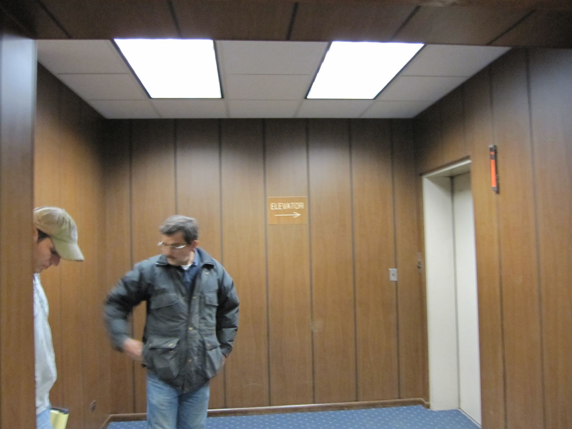 Coiled purple LED light strip on a dark surface.