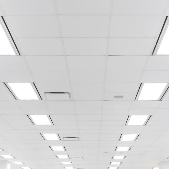 White ceiling with recessed square lights.