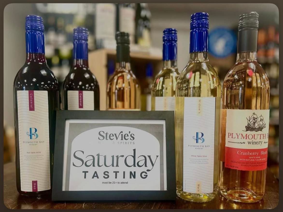 Wine bottles with blue and white labels are displayed for a Saturday tasting at Stevie’s.