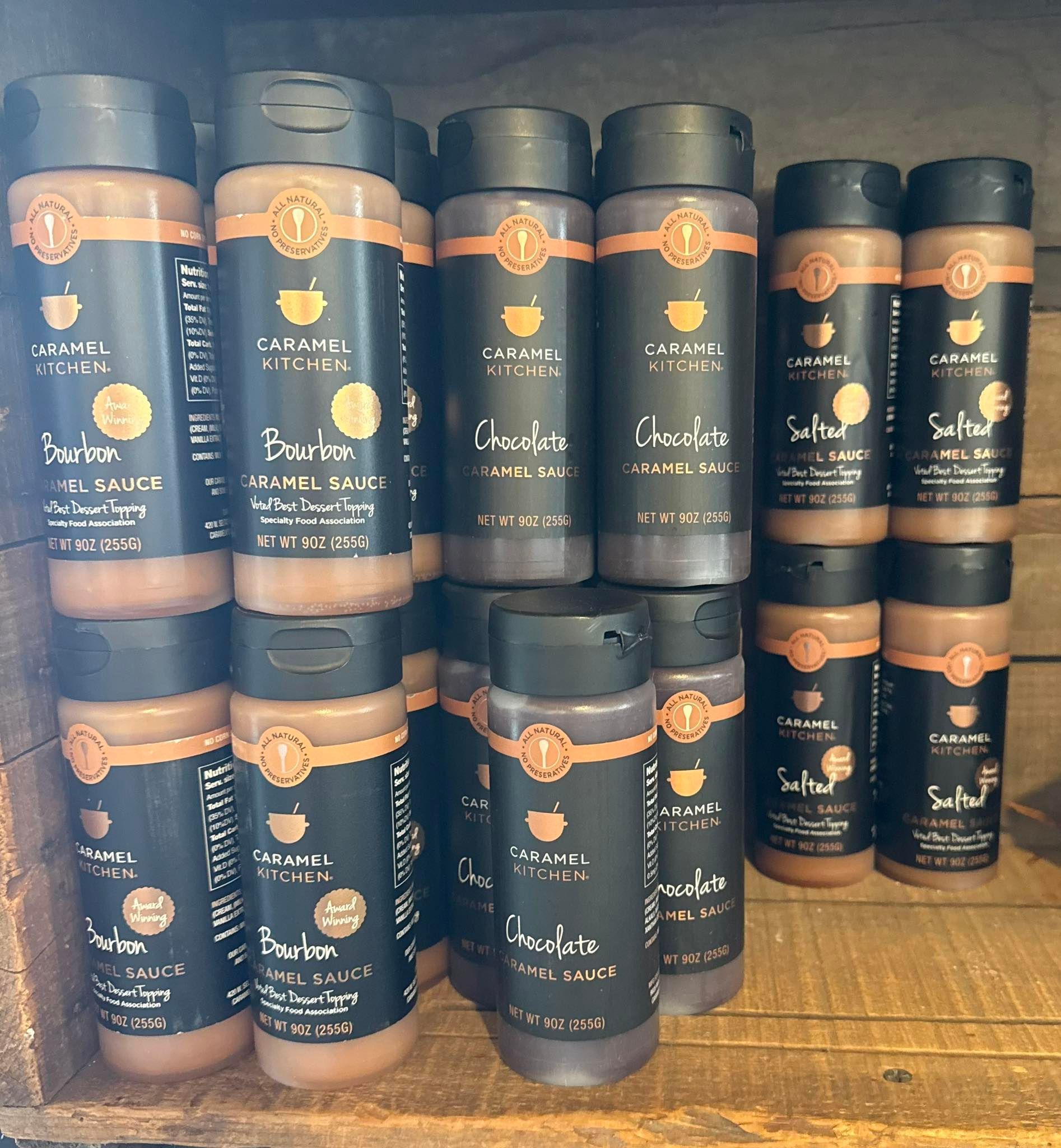 Shelves filled with brown and black spice jars.