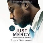 A man in a suit and tie is on the cover of a book called just mercy by bryan stevenson.